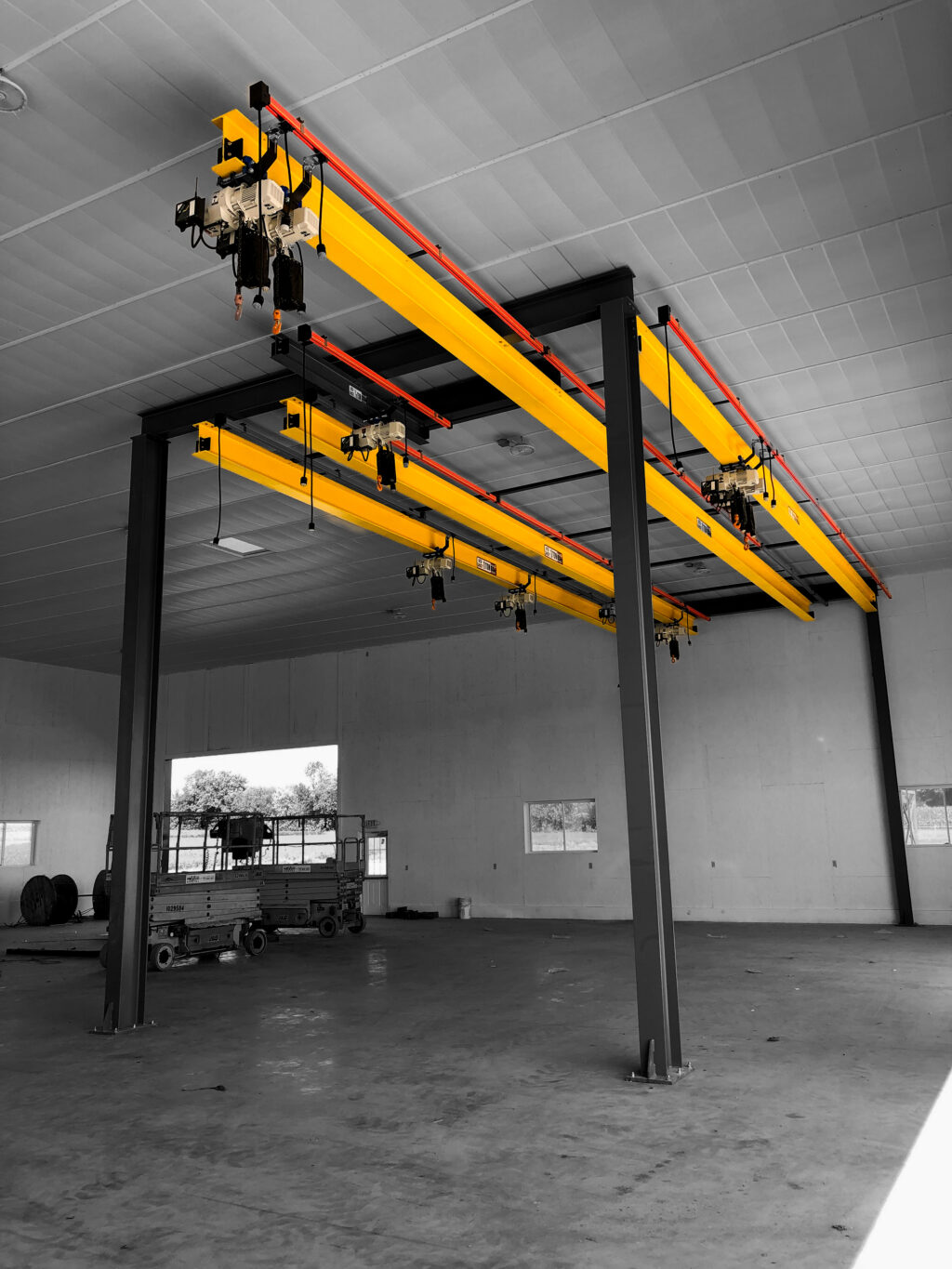1 ton custom freestanding monorail systems with starke hoists in manufacturing setting