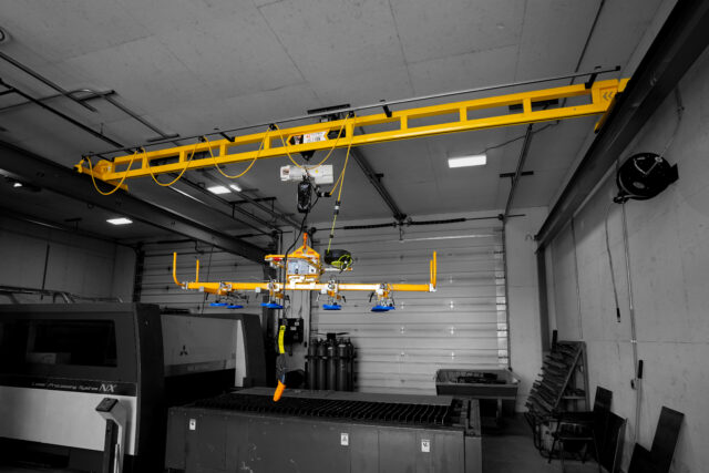 1 ton pwi freestanding hyperlite crane starke hoist with anver lifter in manufacturing setting 2