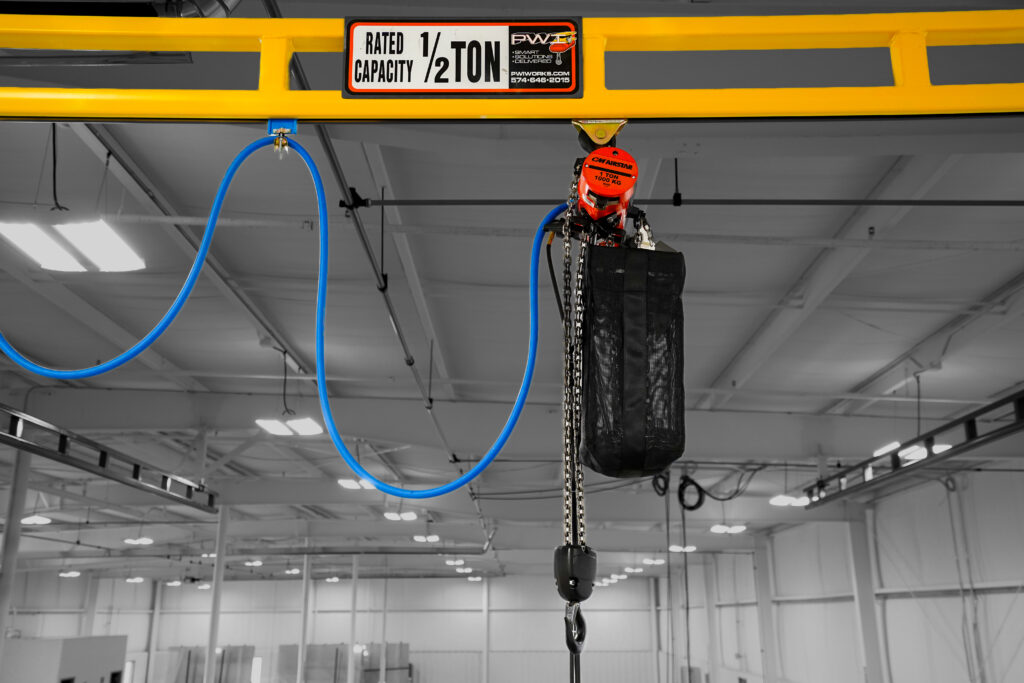 half ton hyperlite ceiling mounted bridge crane in manufacturing setting