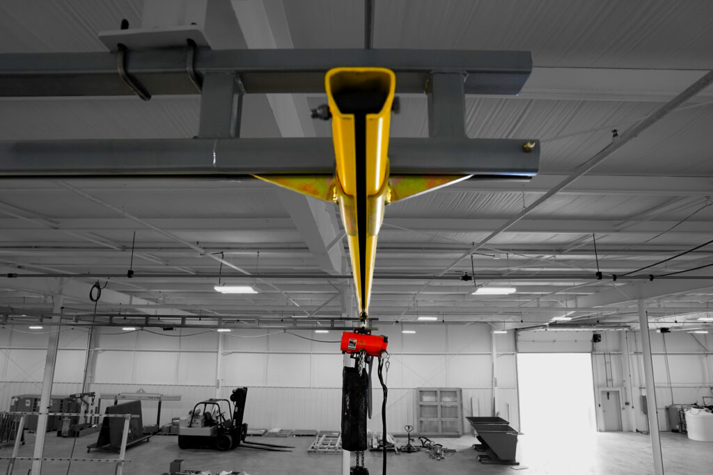 half ton hyperlite ceiling mounted bridge crane railing system in manufacturing setting