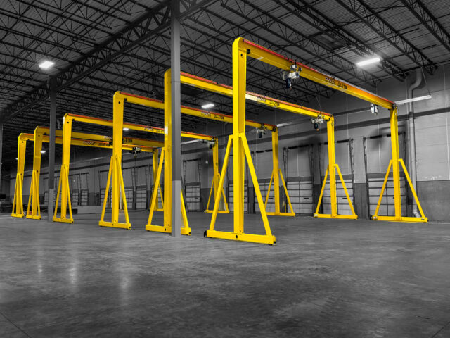 multiple 2 ton pwi motorized gantry cranes in manufacturing setting 2