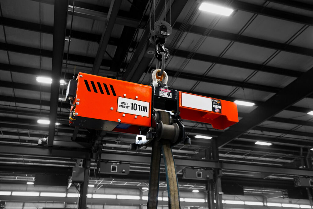 pwi torquewp rotation device lifting steel beam in manufacturing setting
