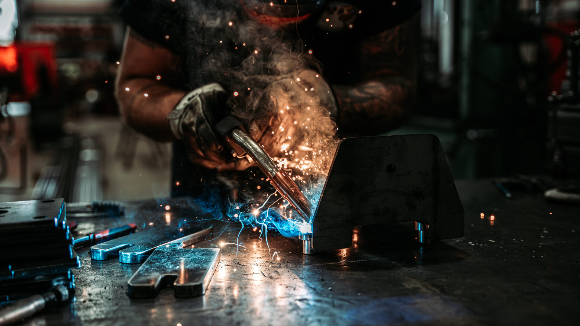 pwi worker welding end truck in production setting