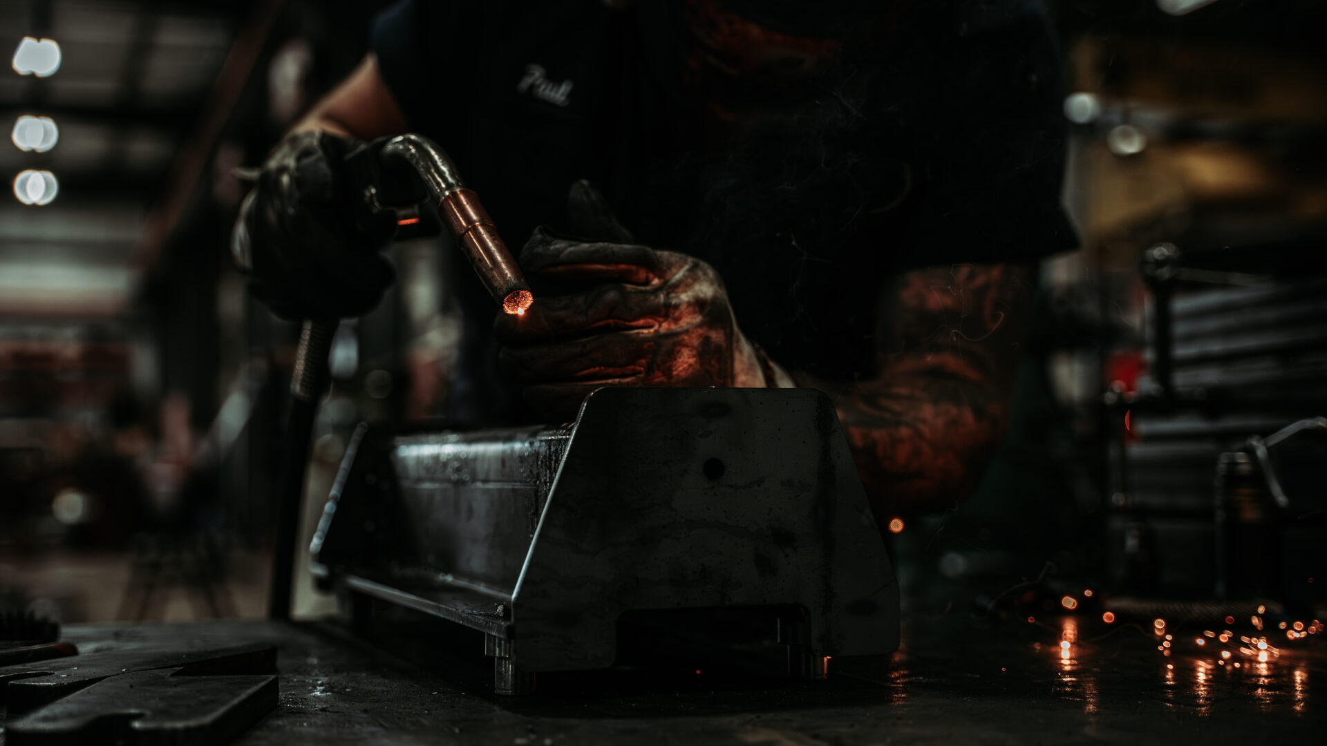 pwi worker welding end truck in production setting