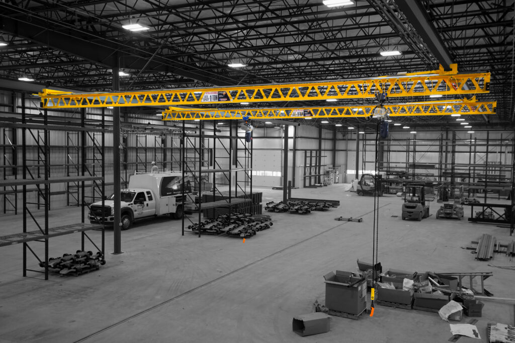 two 1 ton pwi ceiling mounted ultra lite cranes starke hoists in manufacturing setting 1