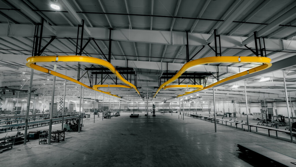 two 3 ton curved monorail cranes in manufacturing setting 2