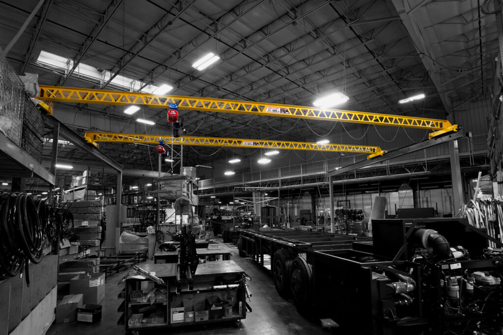 two 500 pound freestanding ultra lite bridges with cm lodestars in rv manufacturing setting 1